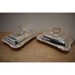 A pair of late 19th/20th Century silver plated and lidded entree dishes of Regency style, each