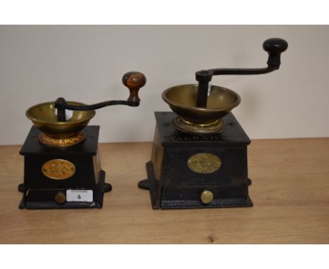 A Victorian cast metal coffee grinder by Baldwin Sons &amp; Co., with brass hopper bowl and drawer to the base, measuring 22c