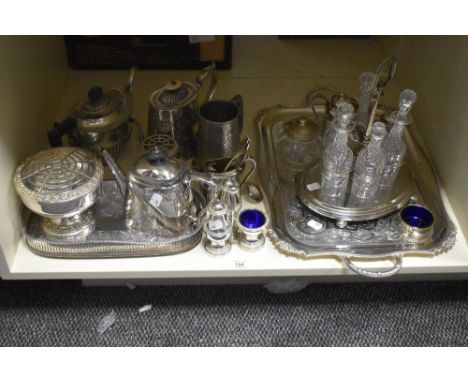 An assorted selection of silver plated ware, to include engraved trays, cruet stand, and rose bowl