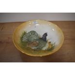 A 20th Century hand painted pottery fruit bowl by Rita Blyth, decorated with a bird design and