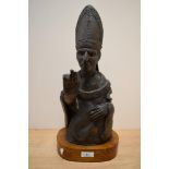 A 20th Century sculpture bust, depicting a papal figure, raised on an oval pine plinth, altogether