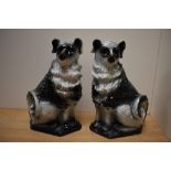 A pair of 19th/20th Century Scottish Bo'ness pottery black and white dogs, with gilt accents and
