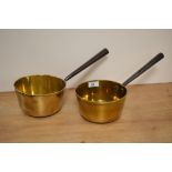 Two 19th Century brass sauce pans with cast iron handles, each measuring 30cm long