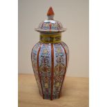 A 19th Century Chinese vase and cover, decorated in polychrome with red, yellow, and green,