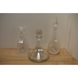 A late 20th Century clear glass ship's decanter and stopper, with etched inscription and measuring