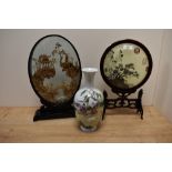 A late 19th Century Chinese cased diorama, the ebonised oval case enclosing an intricately carved