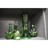 A 19th/20th Century green overlaid flash glass vase of tapering form, measuring 38cm high, and a