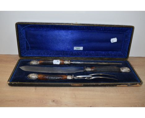 A cased three piece horn handled carving set by Isaac Ellis &amp; Sons of Sheffield
Condition Report:
In good condition, the 
