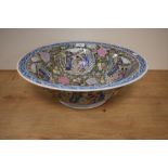A 19th Century Chinese porcelain bowl, decorated with panels of traditional scenes amongst