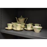 A Grafton china coffee set, the design featuring hand painted green petalled flowers, comprising