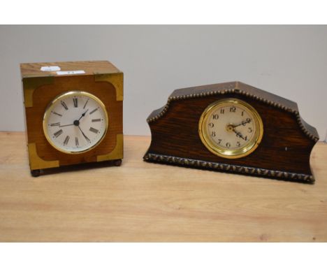 A 20th Century oak and brass bound mantel clock, the case enclosing an enamelled Roman dial, measuring 9cm x 14cm x 13cm, tog