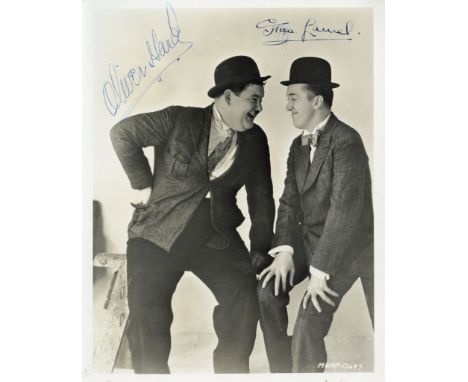 A vintage 10 x 8" black and white photograph of Oliver Hardy and Stan Laurel... A vintage 10 x 8" black and white photograph 