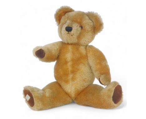 A 1950's Chad Valley plush jointed Teddy bear, bearing label to foot, 36cm high.