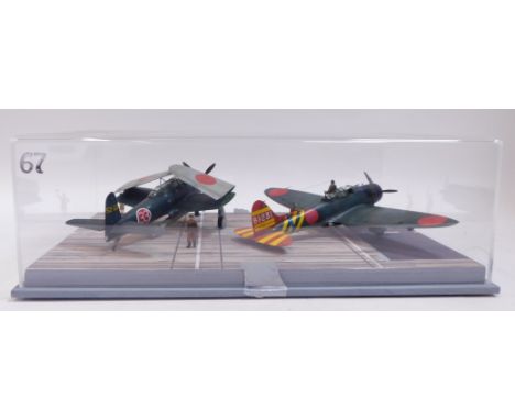 A diorama of Japanese carrier deck scene, for Pearl Harbour Attacks, 1:48 scale, featuring bomber and a Jill, in Perspex case