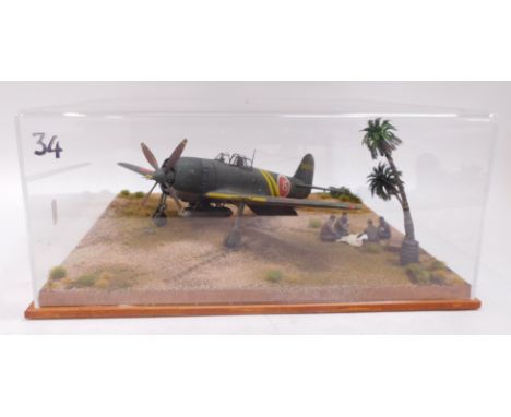 A diorama of Japanese Kawanishi N1K2-Ja Shiden Kai fighter, Allied Code Name George, 1:32 scale, in Perspex case.