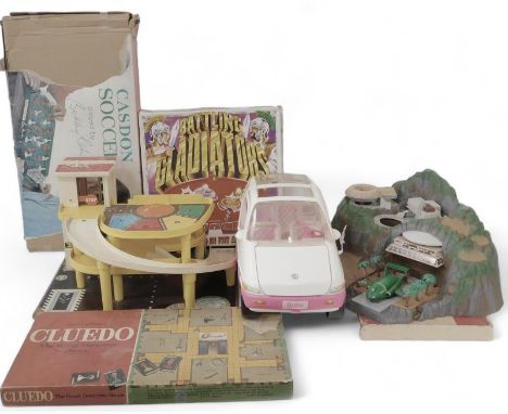 Toys and games, including a Barbie car, Fisher Price garage, Tracy Island play set with Thunderbird 2 and 3, Battling Gladiat