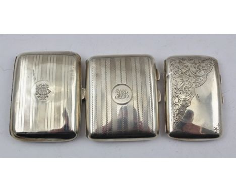 T. HEATLEY A MID 20TH CENTURY SILVER CIGARETTE CASE, Birmingham 1942, together with TWO OTHER CIGARETTE CASES, total weight 2