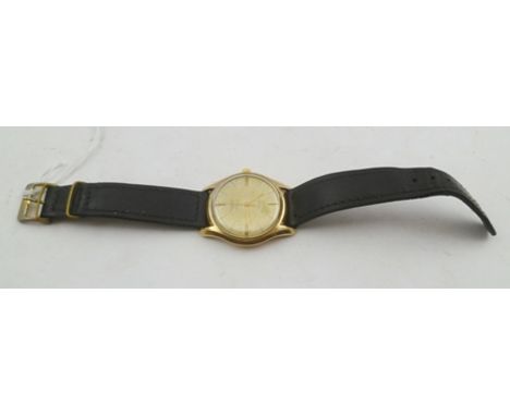 A 9CT GOLD CASED "ROTARY" INCABLOC GENTLEMANS WRIST WATCH, with 25-jewel movement and a black leather strap 