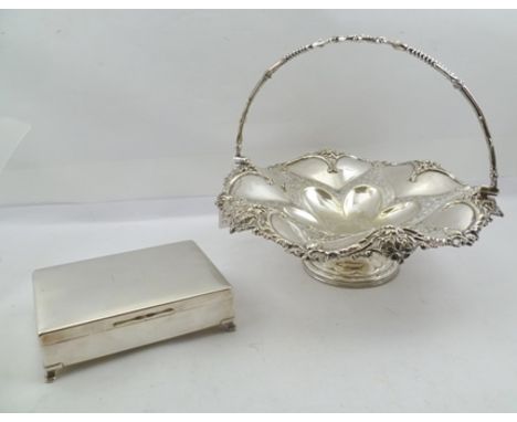 A SILVER PLATED FRUIT DISH, with cast swing handle, on a circular platform base, 32cm diameter, together with an "Aristocrat"