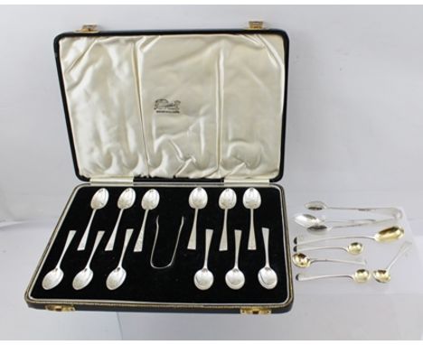 FINNIGANS LTD. A CASED SET OF TWELVE SILVER COFFEE SPOONS WITH SUGAR NIPS, London 1934, together with one other COFFEE SPOON,