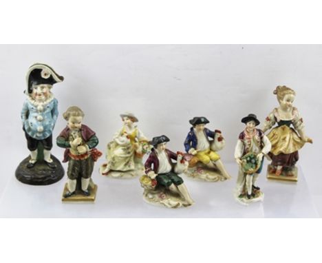 A 19TH CENTURY CONTINENTAL CERAMIC "PUNCH" TYPE CHARACTER 13cm high, together with SIX OTHER CONTINENTAL CERAMIC FIGURINES 