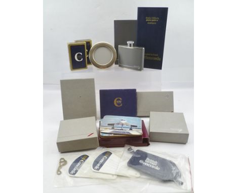 A COLLECTION OF CONCORDE MEMORABILIA, to include three silver photograph frames, a pair of silver decanter labels "Vodka" and