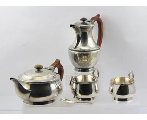 J B CHATTERLEY & SONS LTD A GEORGIAN DESIGN FOUR PIECE SILVER TEA SET, comprising tea pot, lidded hot water pot, milk jug and