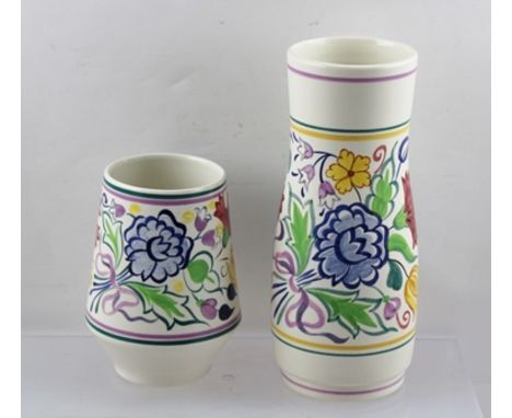 A POOLE POTTERY HAND PAINTED VASE with stylised floral design, 23.5cm high together with a smaller POOLE VASE, 15cm high (2) 