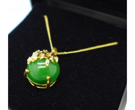 A silver gilt, jade and ten diamond pendant on chain