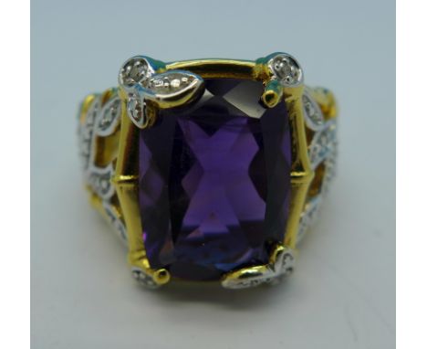 A silver gilt, amethyst and diamond ring, O