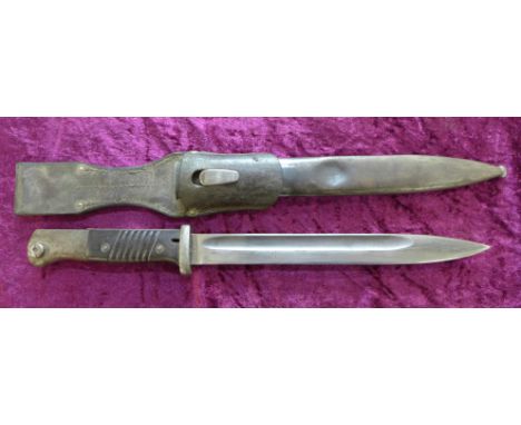 A German bayonet with scabbard, the blade marked 31 cul. and 5928, the scabbard marked P. Weyersberg, 1939 also 1711, with fr