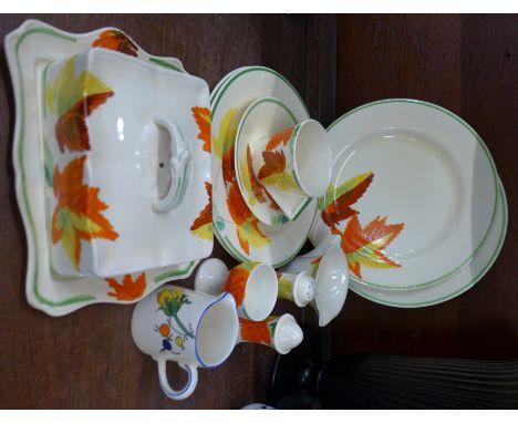 A.J. Wilkinson Honeyglaze pottery decorated with autumn leaves including two large plates, two medium plates, a cup and sauce