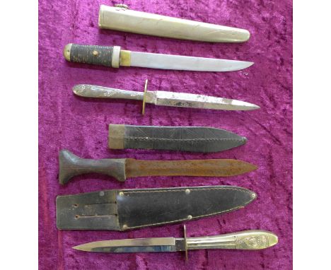 Four daggers; two with blades marked Woodhead, one with tooled leather scabbard and one Japanese, 26.5cm, no mark on tang, al
