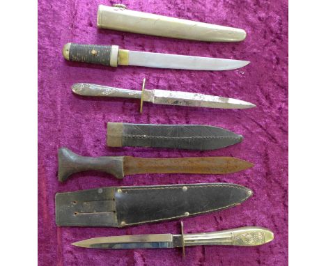 Four daggers; two with blades marked Woodhead, one with tooled leather scabbard and one Japanese, 26.5cm, no mark on tang, al