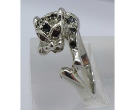 A leopard ring set with white stones and garnet eyes, Q