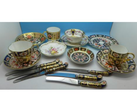 Two Spode cups and saucers, a Royal Crown Derby cup and saucer, a 2451 pattern trio, six pistol grip knives, one a/f, and two
