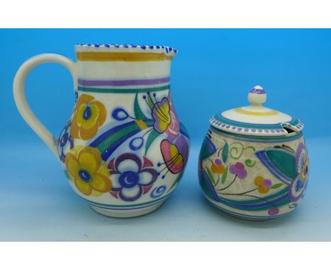 A Poole Pottery jug and preserve pot