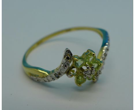 A 9ct gold, peridot and diamond ring, lacking one stone, 1g, O