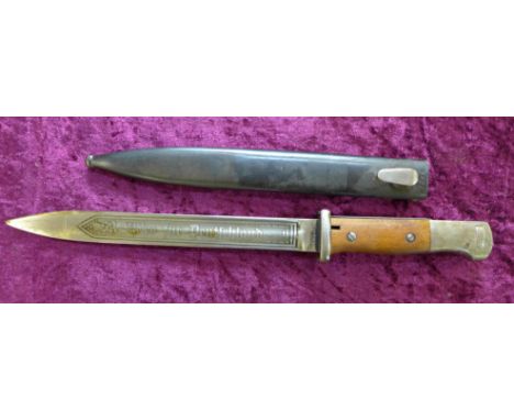 A German SA bayonet with scabbard, the bayonet marked 44 fnj and 3709, the scabbard marked jwh43 and 5624