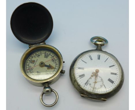 A continental silver pocket watch and a pocket compass