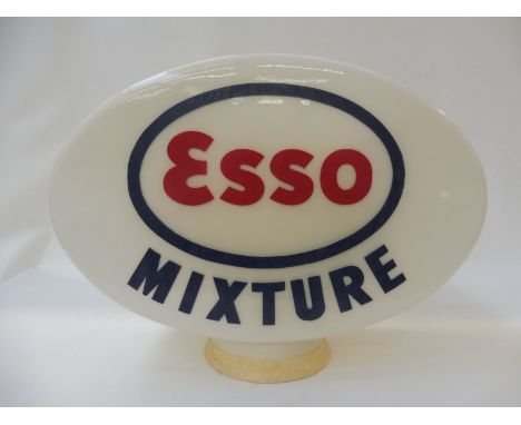 An Esso Mixture glass petrol pump globe dated February 1958.