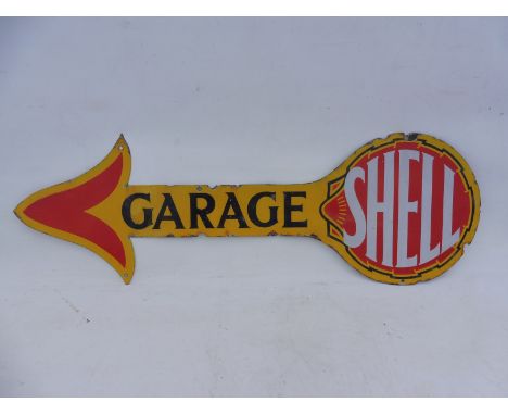 An early Shell Garage directional double sided enamel arrow, with some restoration, 36 x 11 3/4".
