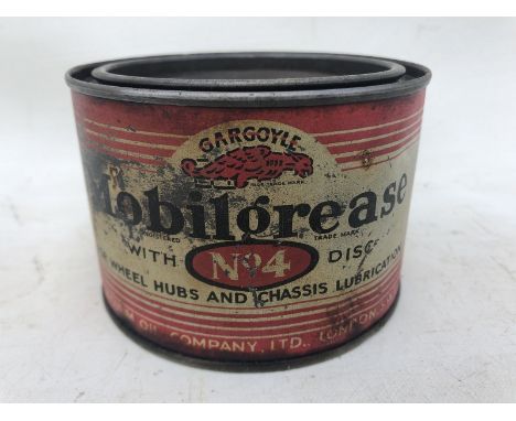 A Gargoyle Mobil Grease no. 4 circular tin.