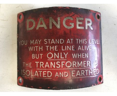 A curved red enamel Danger sign relating to live railway lines, 5 1/2 x 4 1/2". 