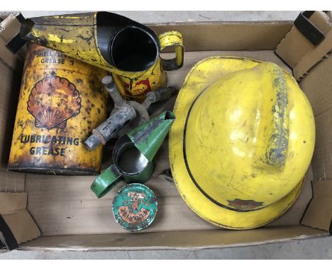 A large Shell lubricating grease tin, various other oil measures and a Devon Fire and Rescue Service helmet etc. 