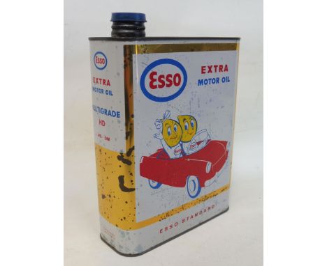 An Esso Extra Motor Oil 20W40 multi-grade oil can with image to one side depicting two Esso figures driving a car.