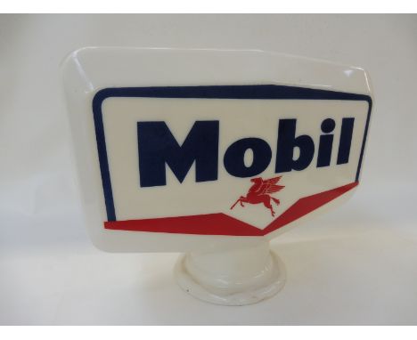 A Mobil glass petrol pump globe stamped Made in England, with chipping to neck.