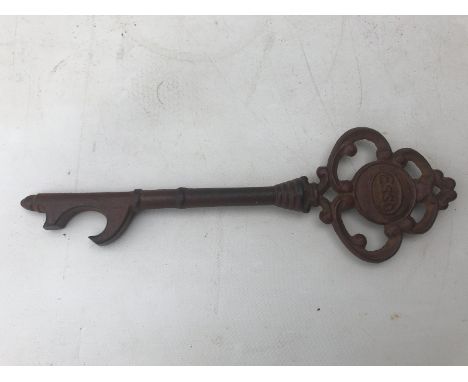 An unusual Esso novelty key-shaped oil can opener.