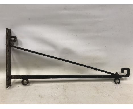 A wall mounted bracket for hanging a lightbox or heavy swinging sign. 