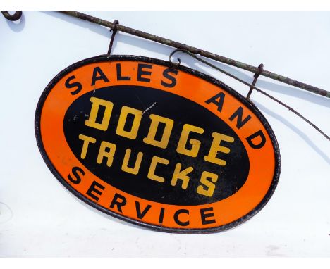 A Dodge Trucks Sales and Service oval double sided painted advertising sign on 1 1/8" hanging bracket, the sign measures 36 x